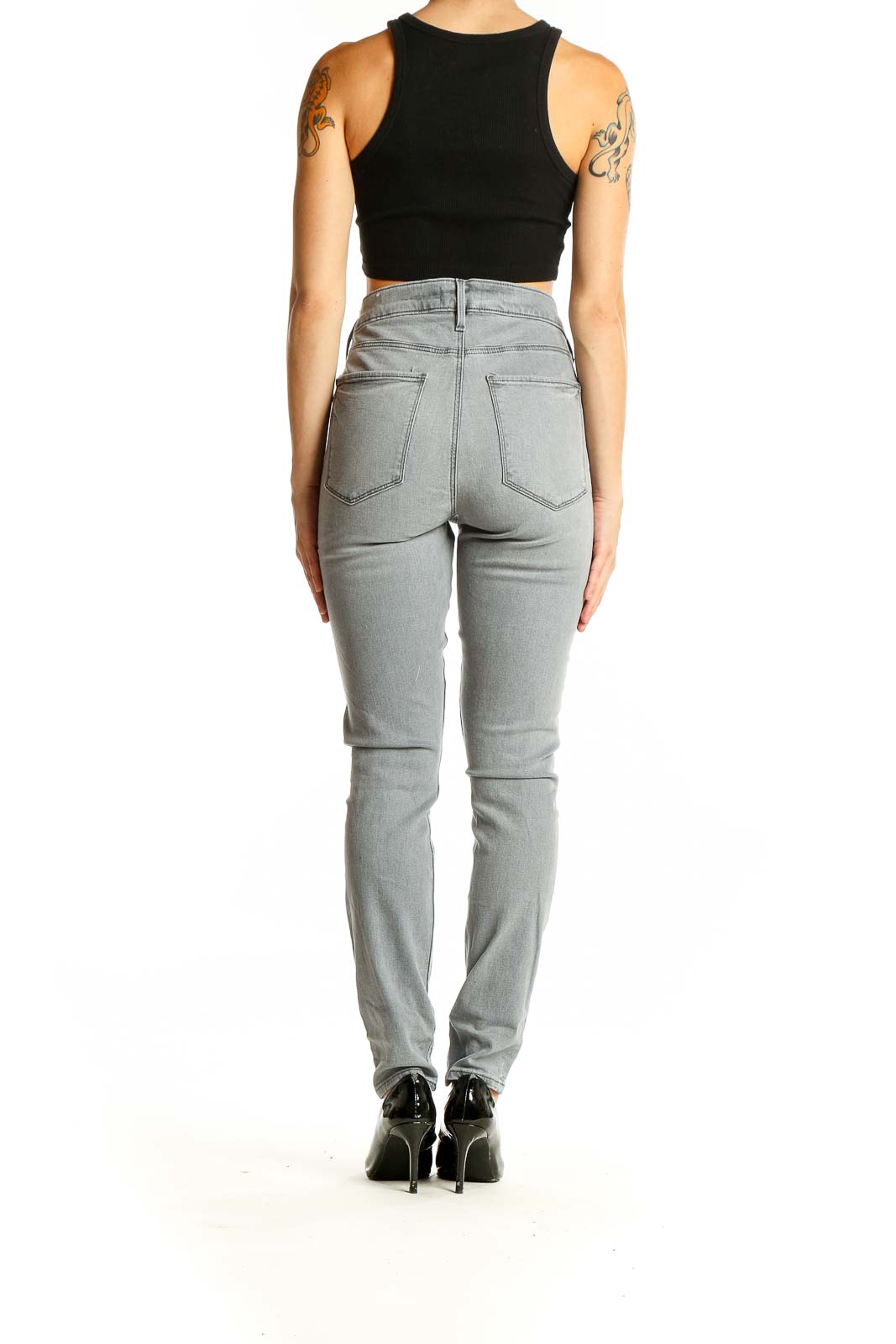 Back view of LOFT gray high-waisted skinny jeans on model