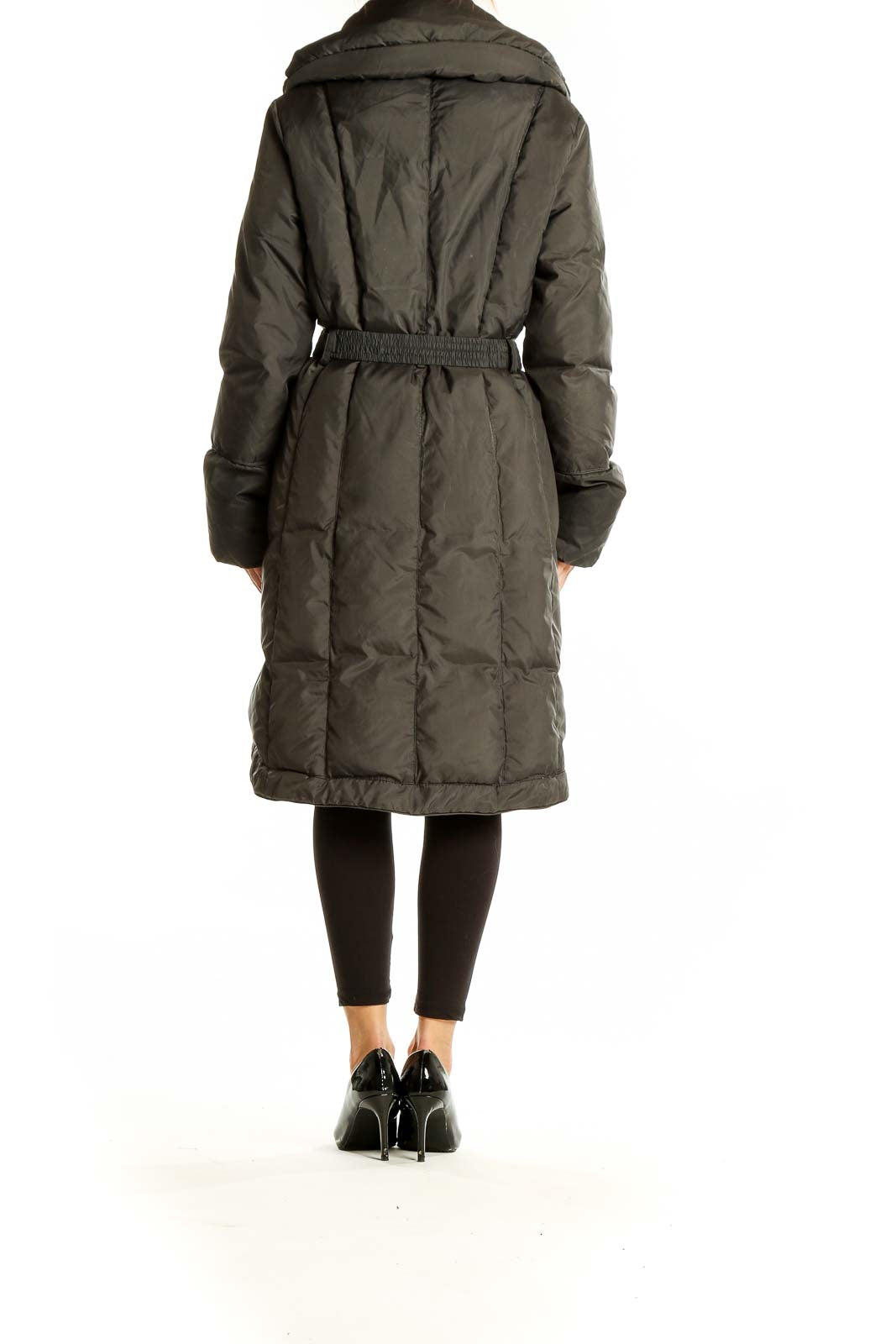 Side view of Cole Haan olive green belted down puffer coat on model