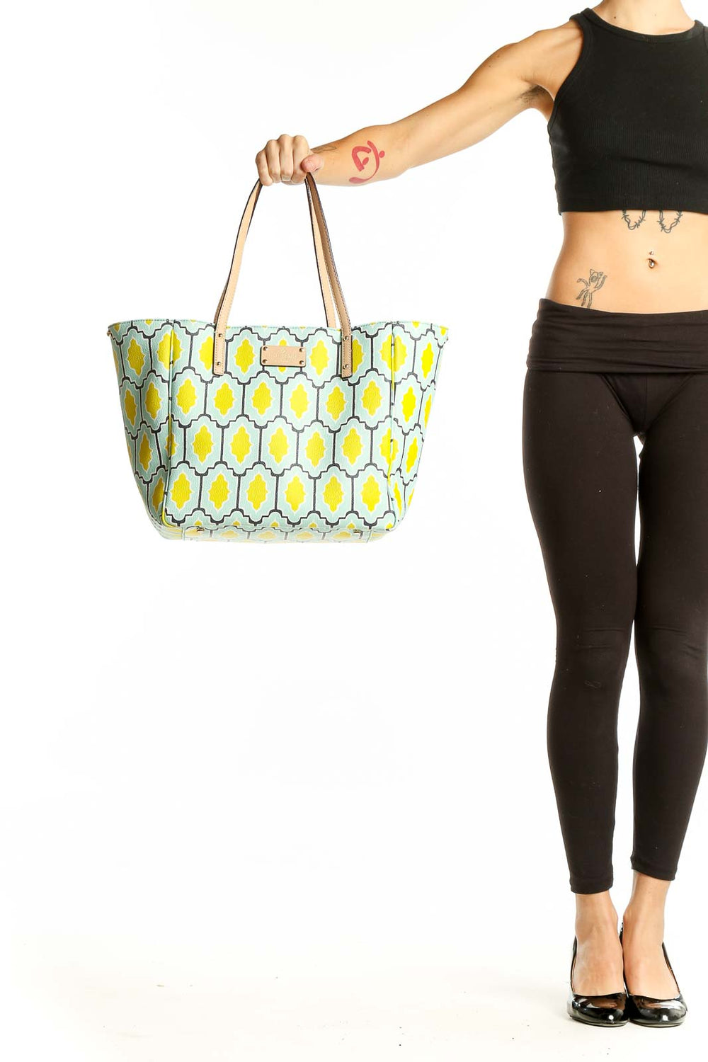 Front view of Kate Spade yellow and mint geometric print tote bag