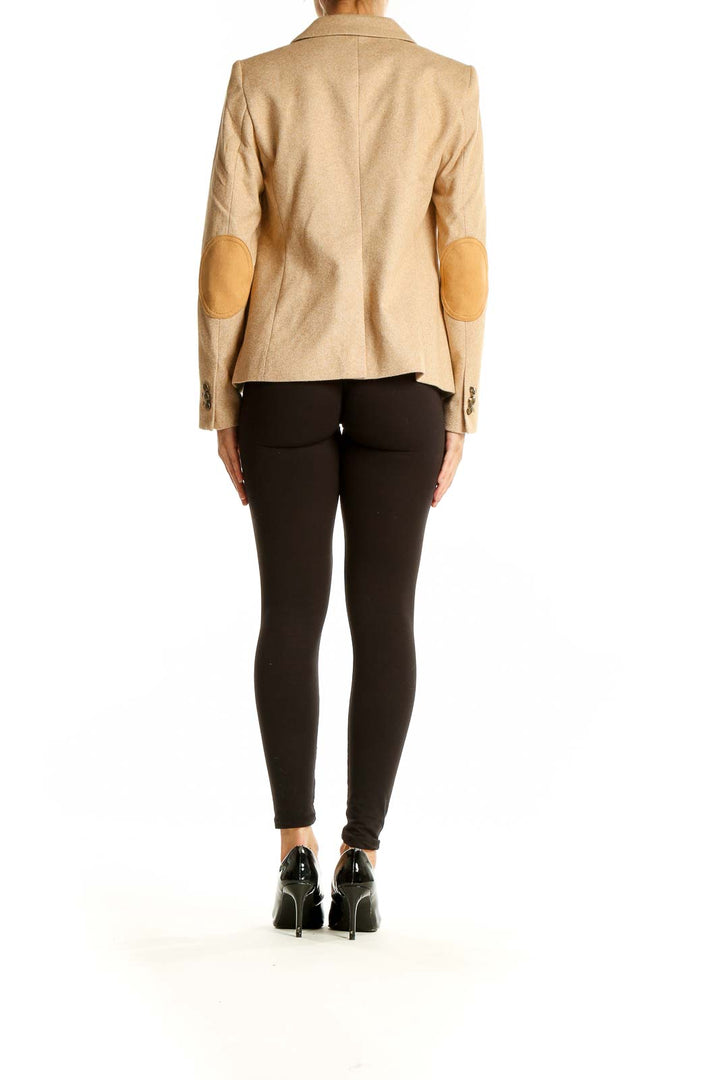 Back view of LOFT beige single-button blazer on model with black pants