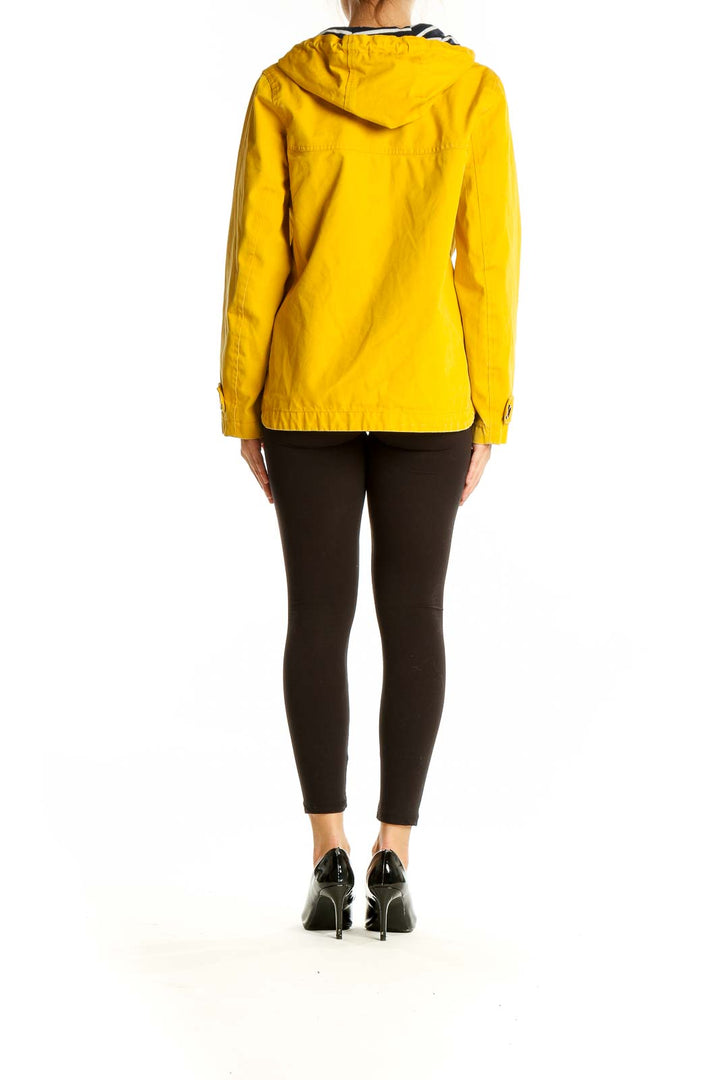 Back view of yellow Joules hooded coat showing relaxed fit