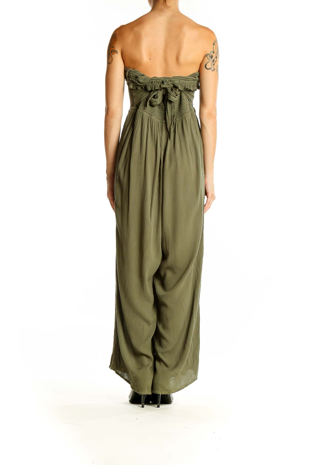 Back view of olive strapless maxi jumpsuit showing full-length design