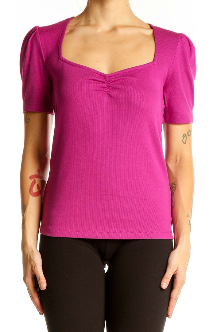 Front view of magenta LOFT top with puff sleeves and sweetheart neckline