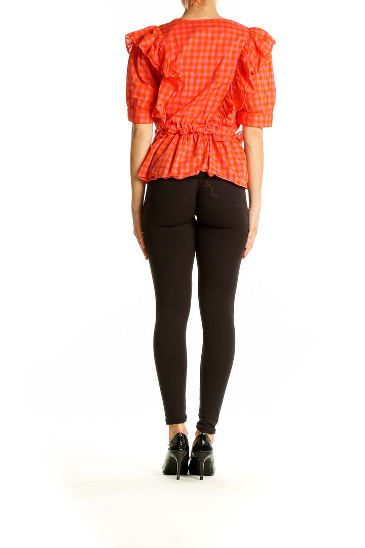Back view of orange gingham ruffle wrap top from J.Crew