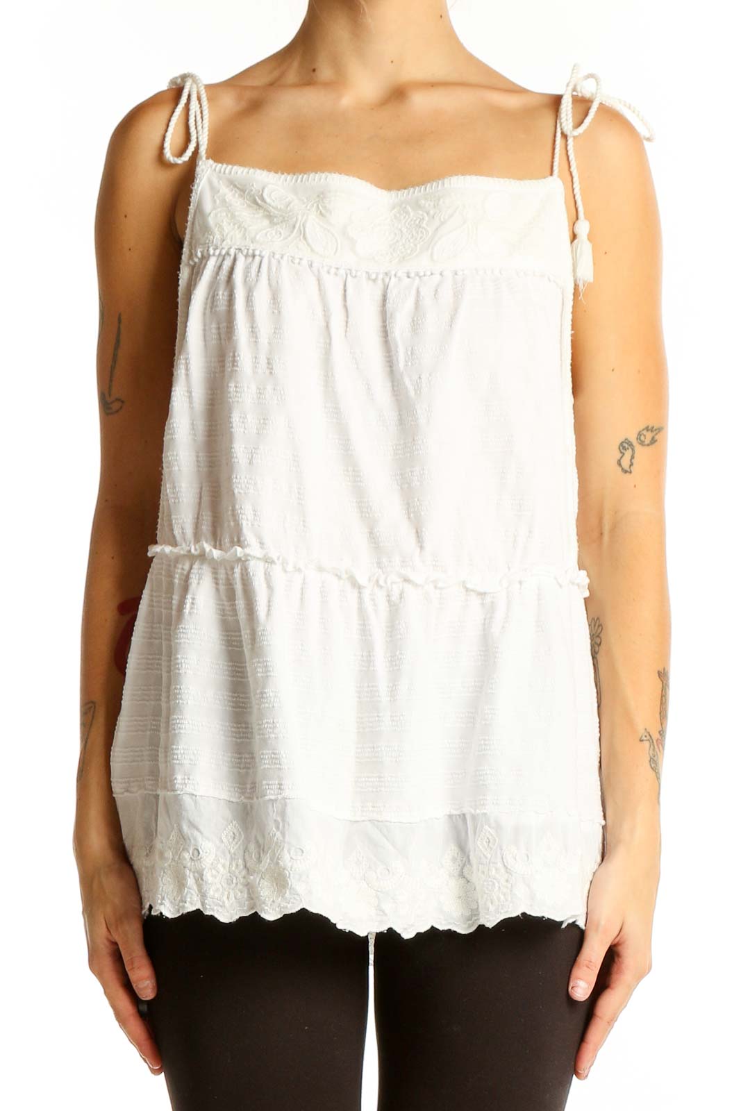 Front view of white tiered cotton camisole top from Anthropologie