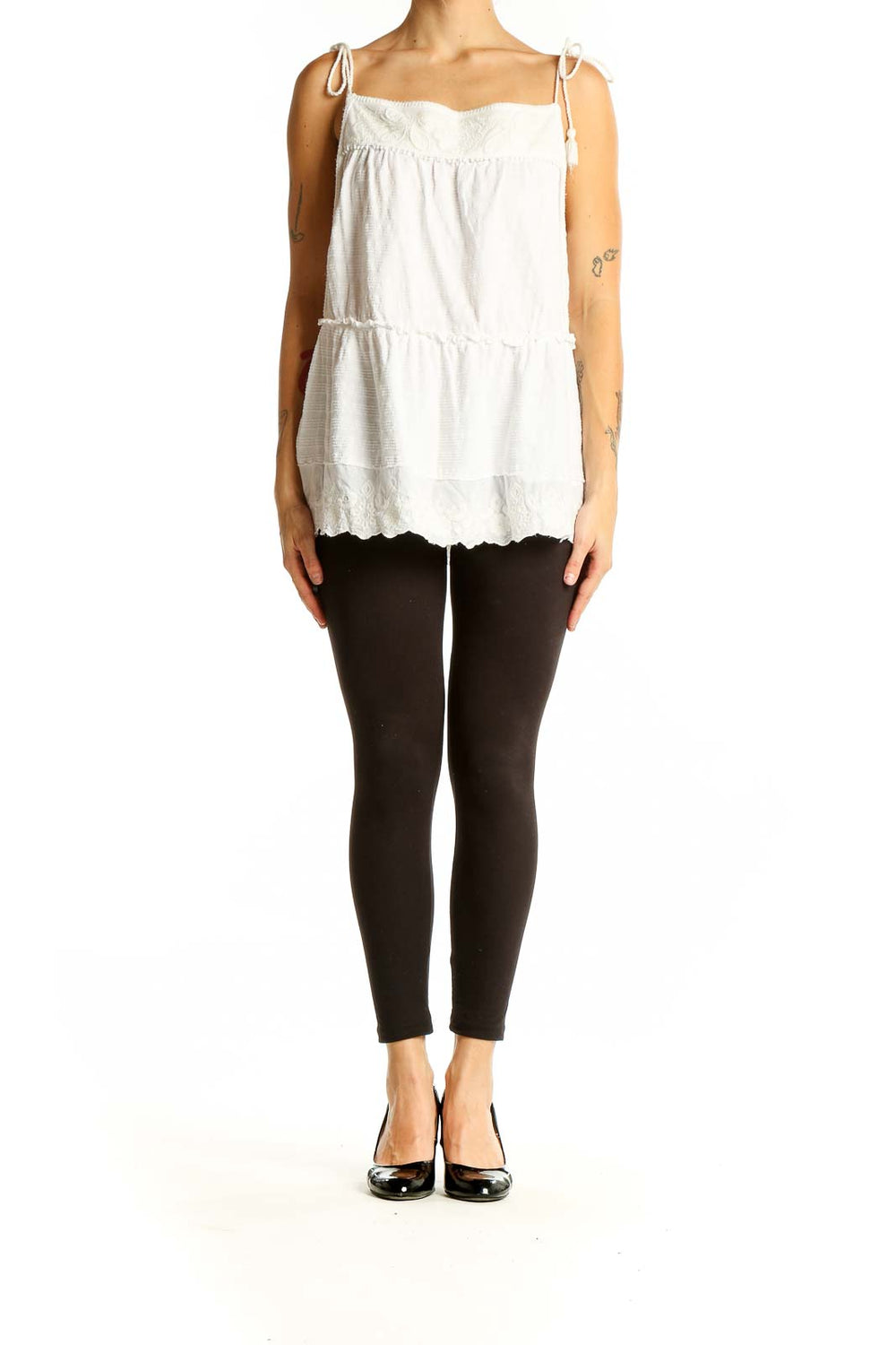 Front view of white tiered cotton camisole top from Anthropologie