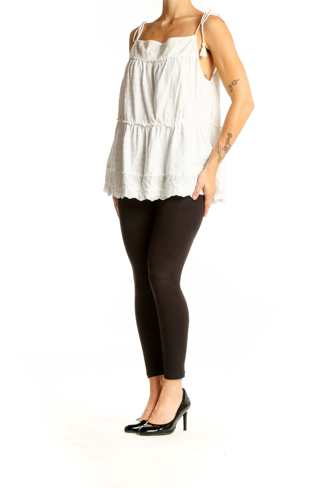 Front view of white tiered cotton camisole top from Anthropologie