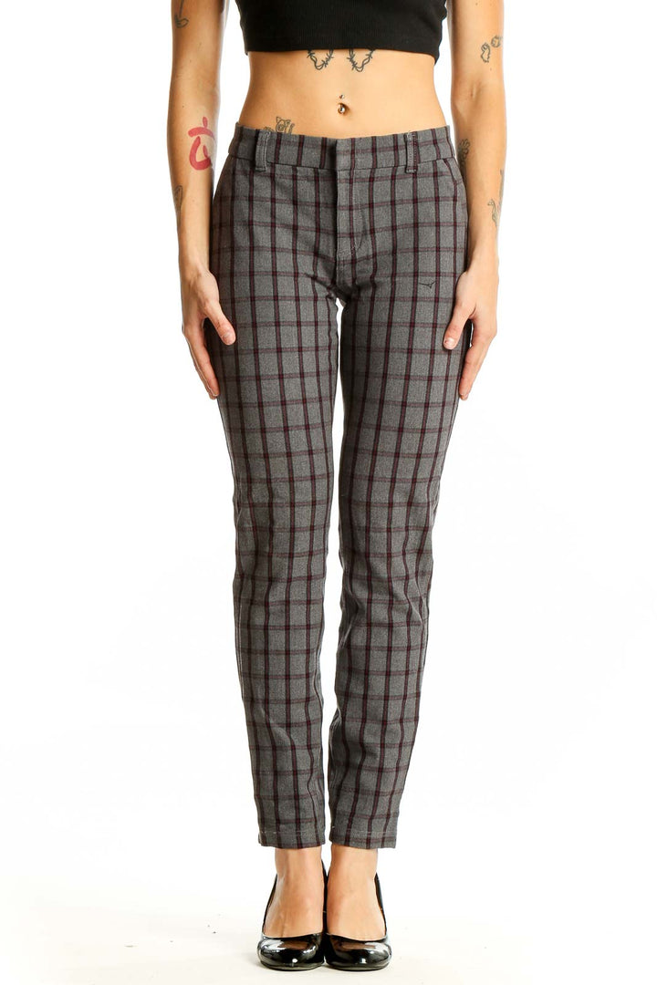 Front view of KUT from the Kloth gray plaid trousers on model