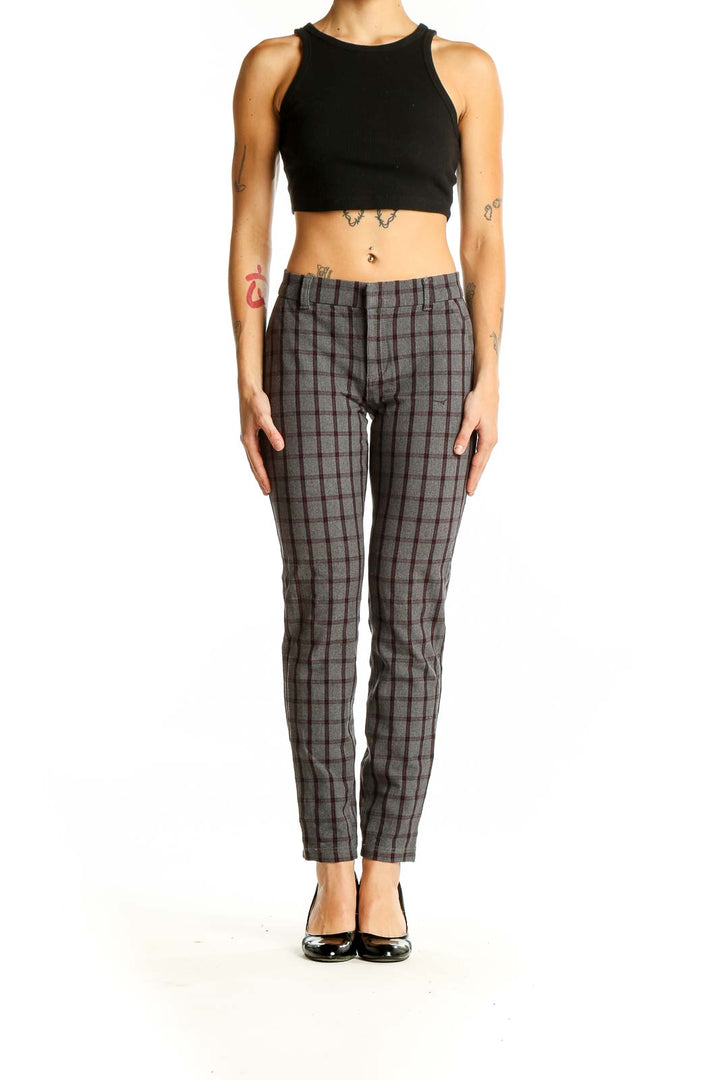 Front view of KUT from the Kloth gray plaid trousers on model