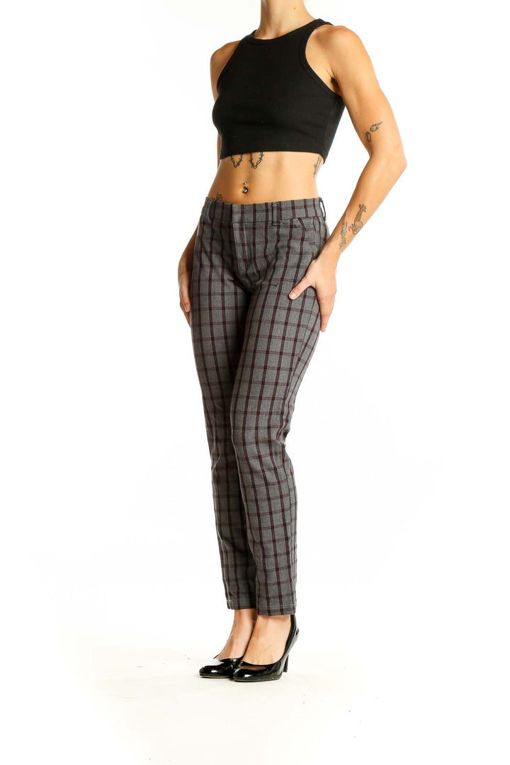 Front view of KUT from the Kloth gray plaid trousers on model