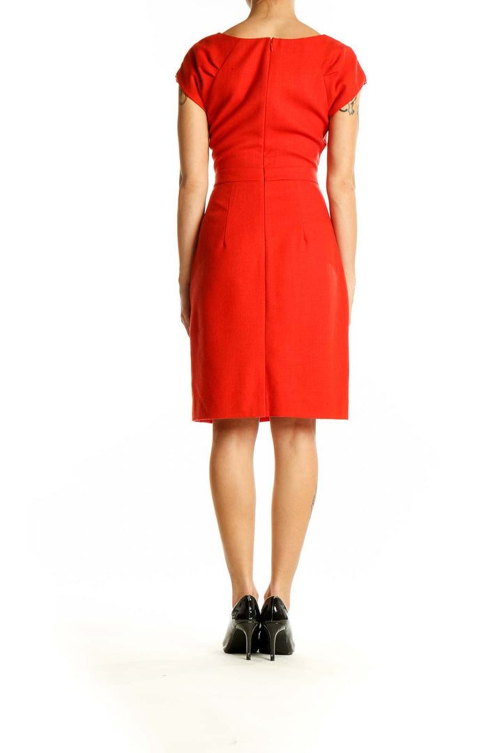 Side view of J.Crew red sheath dress showing fitted silhouette