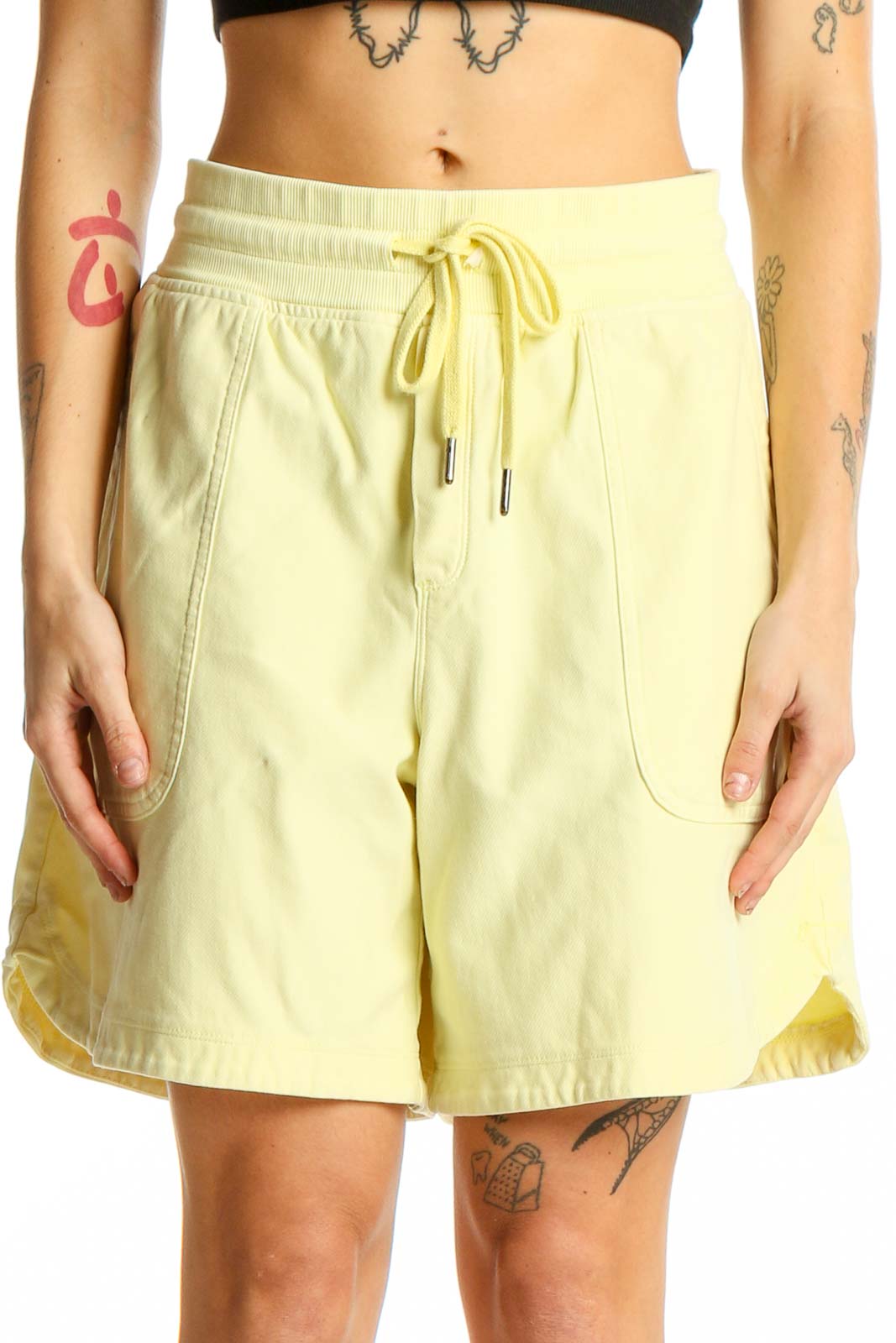 Front view of yellow Callaway drawstring shorts with side pockets