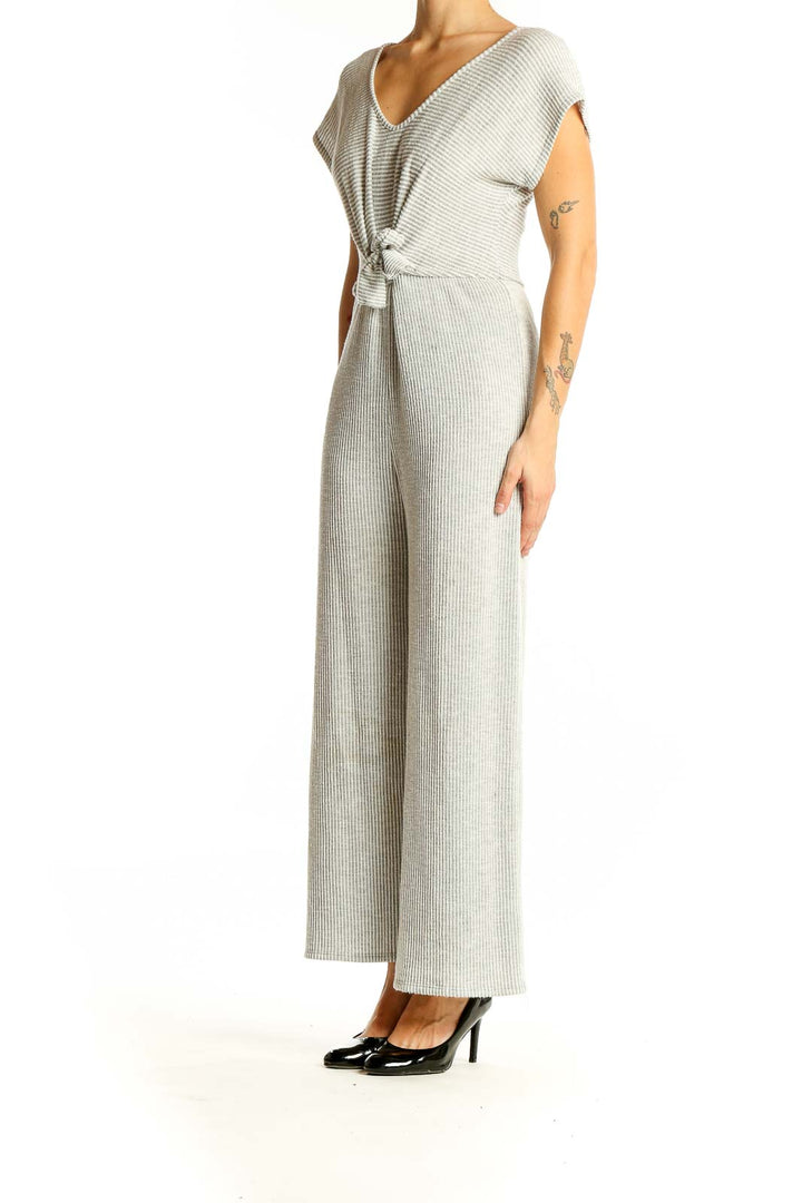 Front view of gray ribbed tie-front jumpsuit by Caution to the Wind