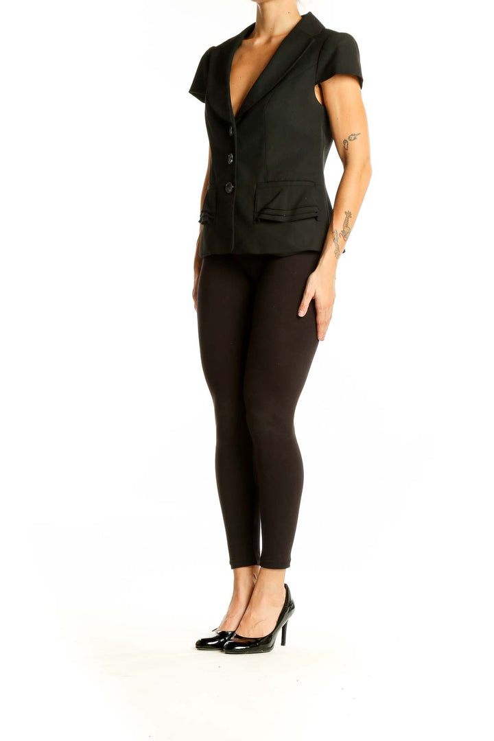 Front view of black short-sleeve blazer from The Limited