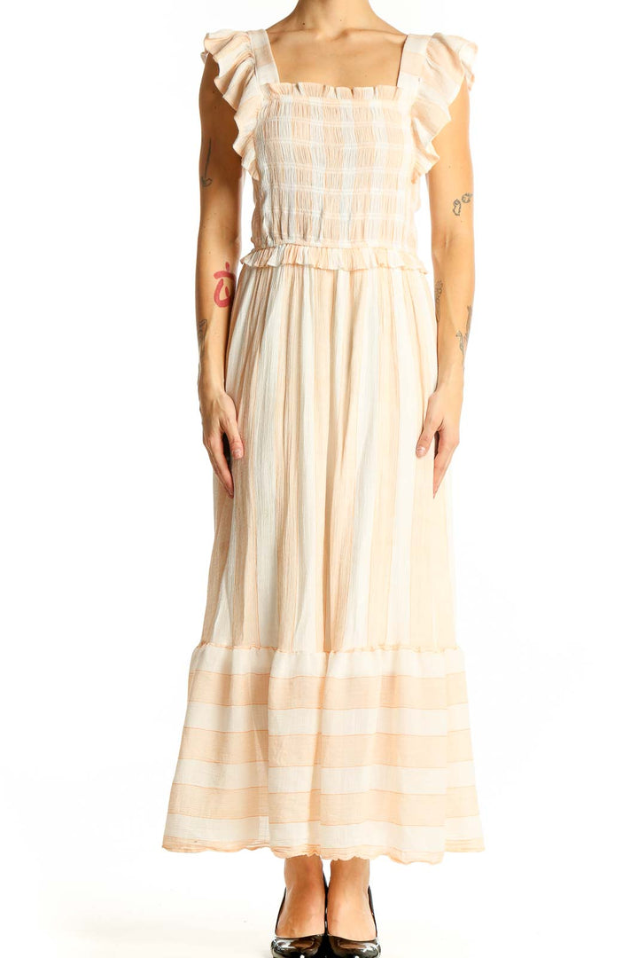 Front view of SilkRoll peach maxi dress with smocked bodice and ruffled sleeves