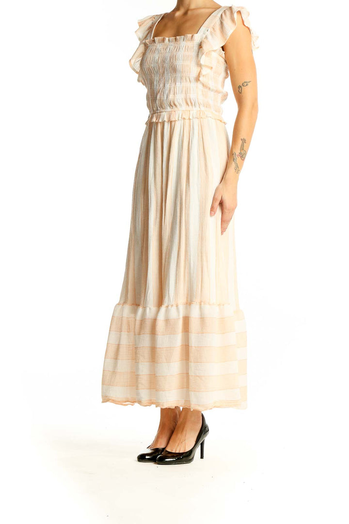 Front view of SilkRoll peach maxi dress with smocked bodice and ruffled sleeves