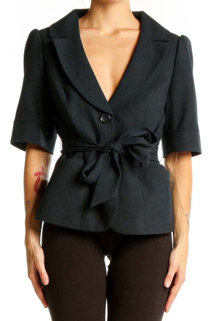 Front view of black short-sleeve belted blazer from The Limited