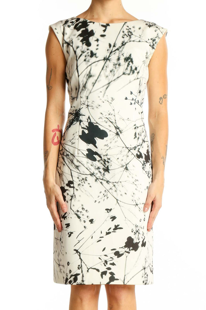 Front view of Tahari Arthur S. Levine white sheath dress with black abstract floral print