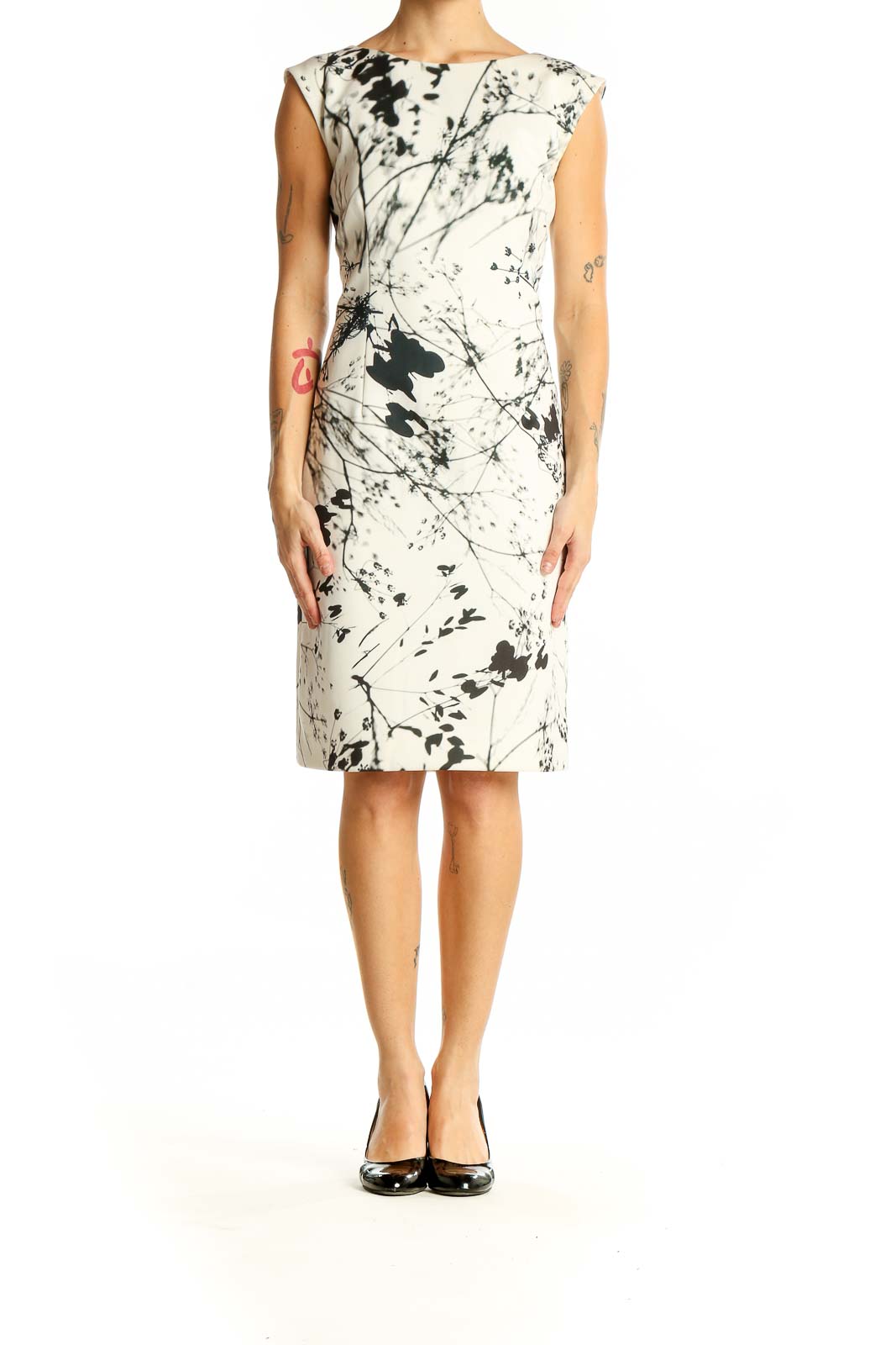 Front view of Tahari Arthur S. Levine white sheath dress with black abstract floral print