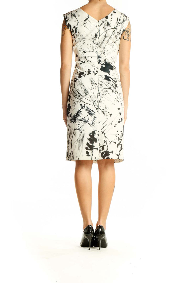 Back view of Tahari Arthur S. Levine white sheath dress showcasing the abstract floral pattern