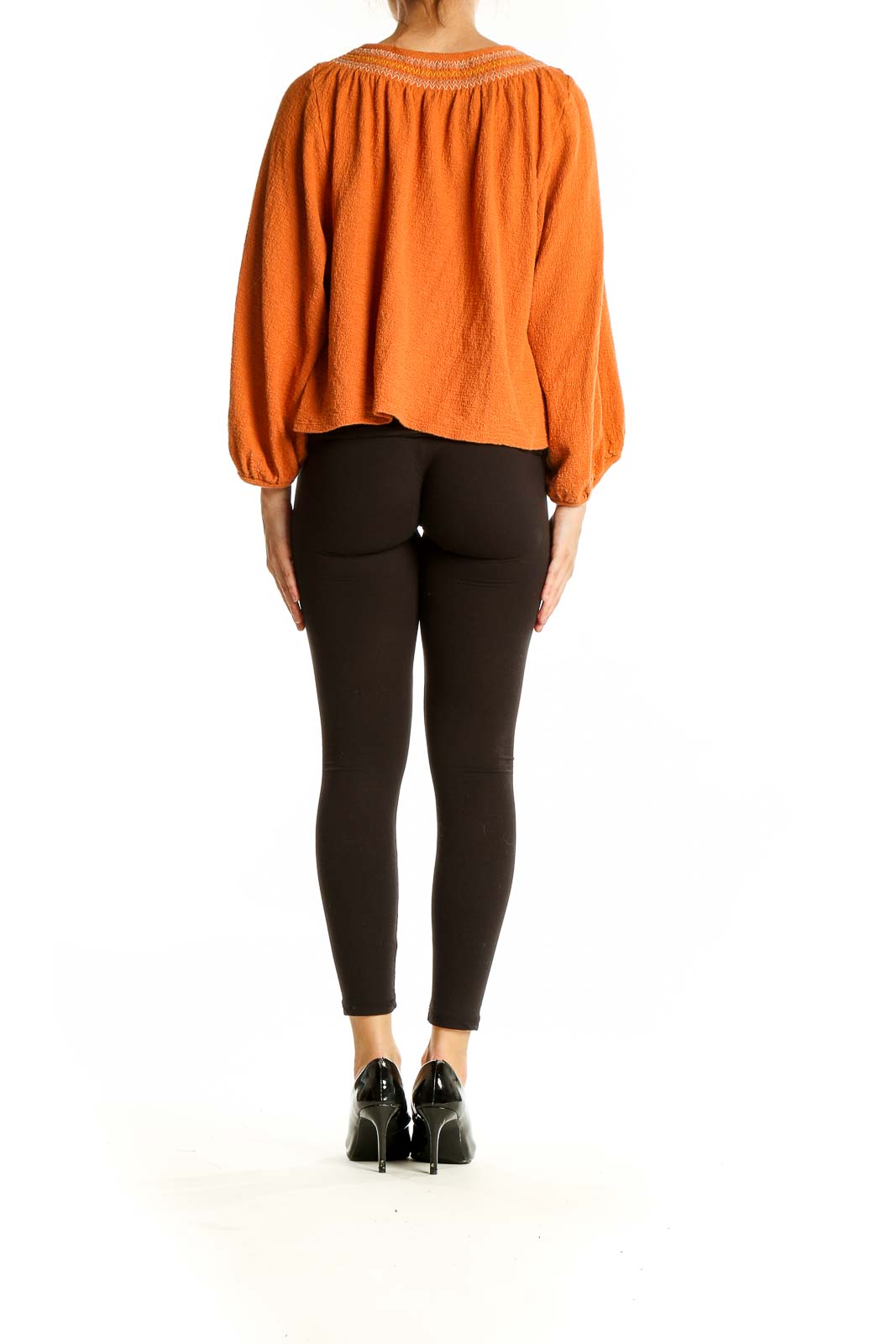 Back view of orange Madewell cotton knit peasant top showing relaxed fit