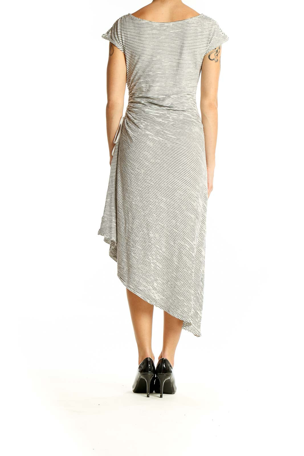 Side view of Max Studio gray striped asymmetrical midi dress showing flowing hemline