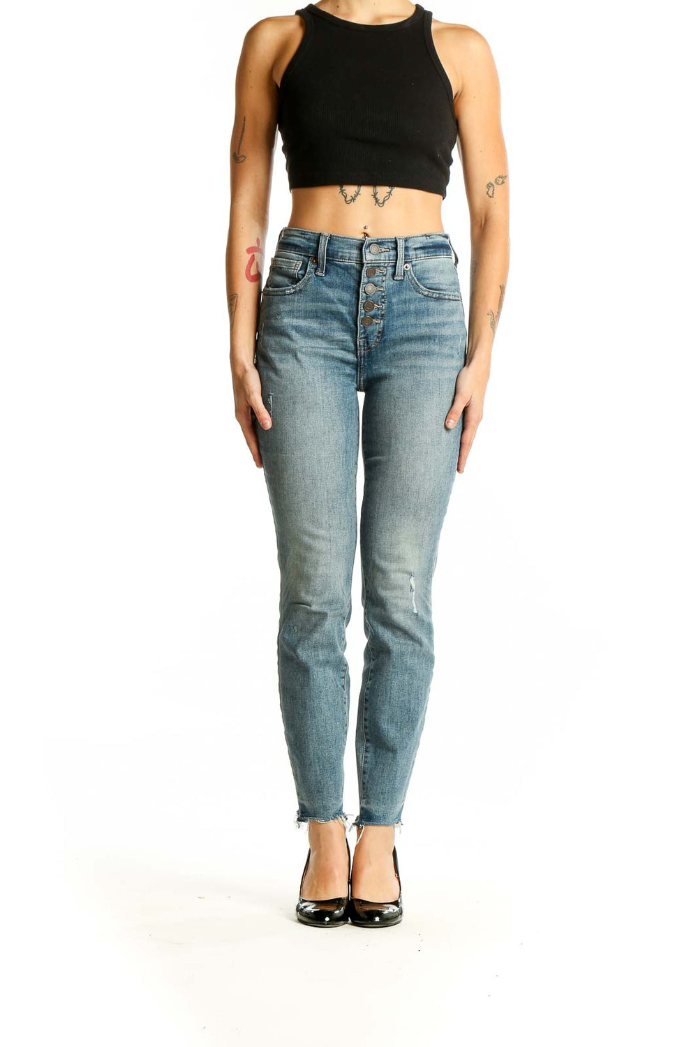 Front view of Lucky Brand light blue distressed skinny jeans on model