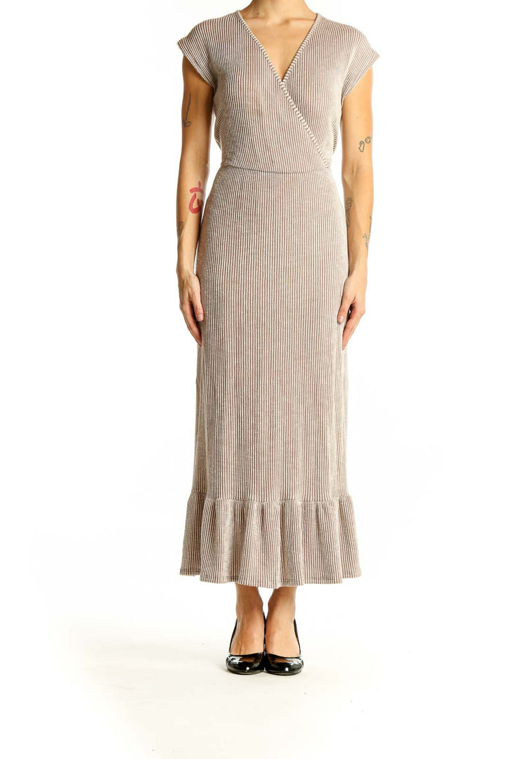 Front view of beige ribbed wrap maxi dress with V-neck and ruffle hem