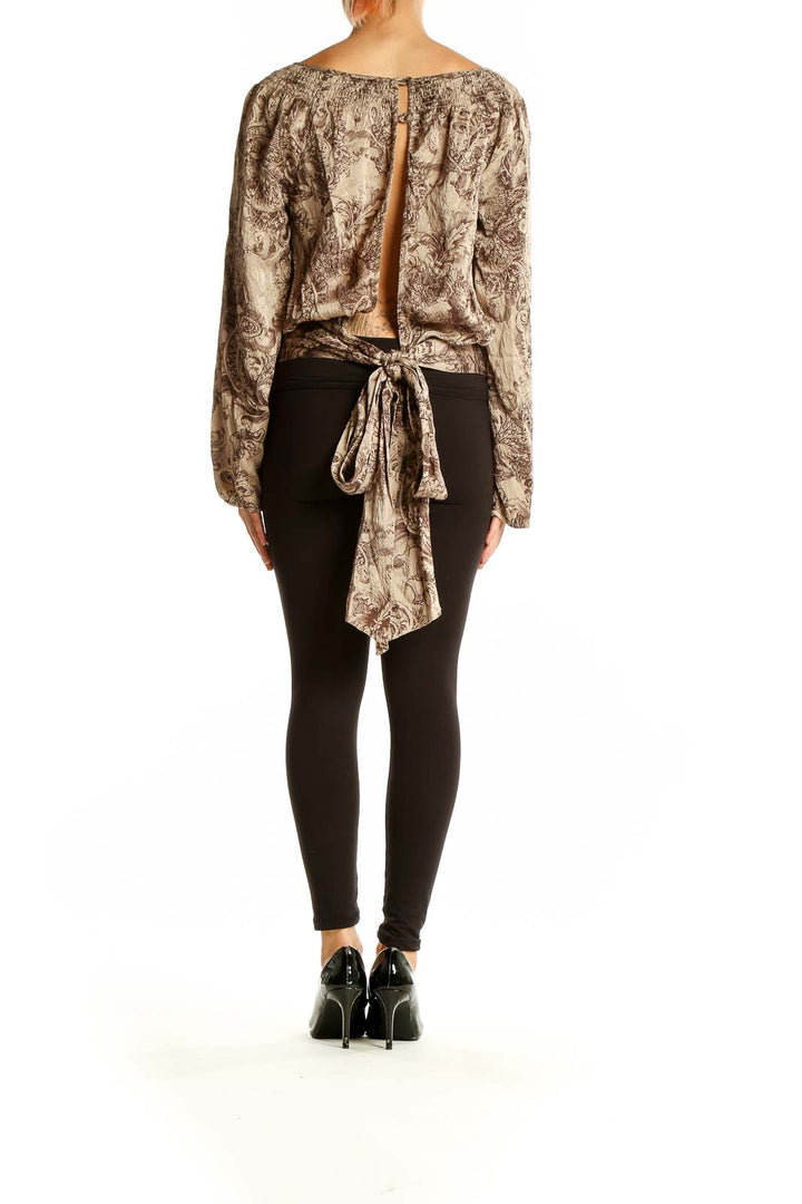 Back view of BCBG MaxAzria beige silk peasant blouse showing floral pattern and relaxed fit