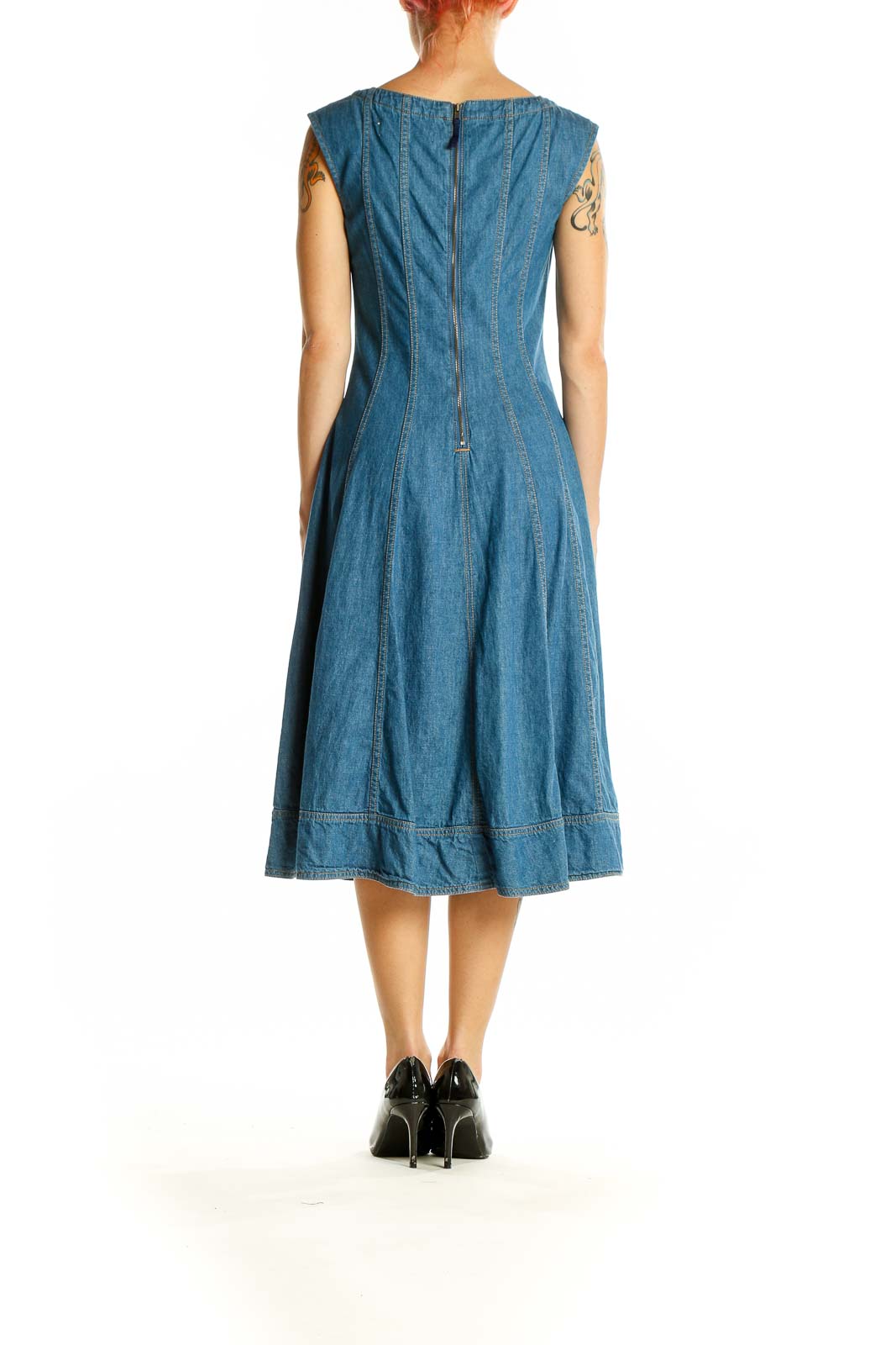 Side view of Pilcro and the Letterpress blue denim fit-and-flare midi dress