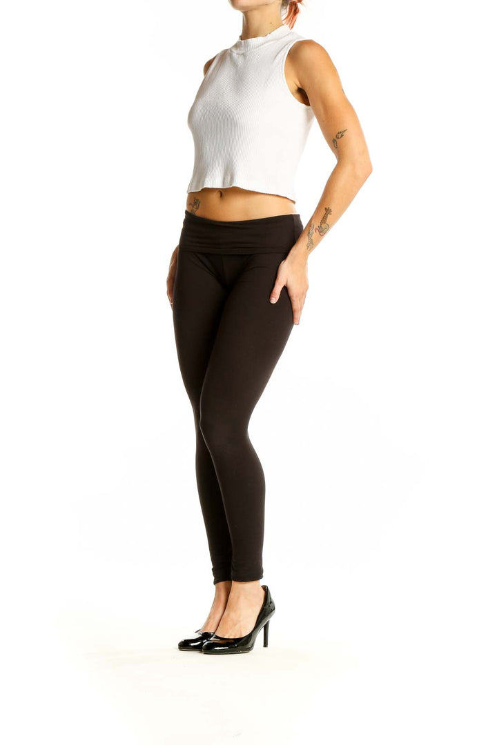 Front view of Uniqlo white ribbed crop tank top on model