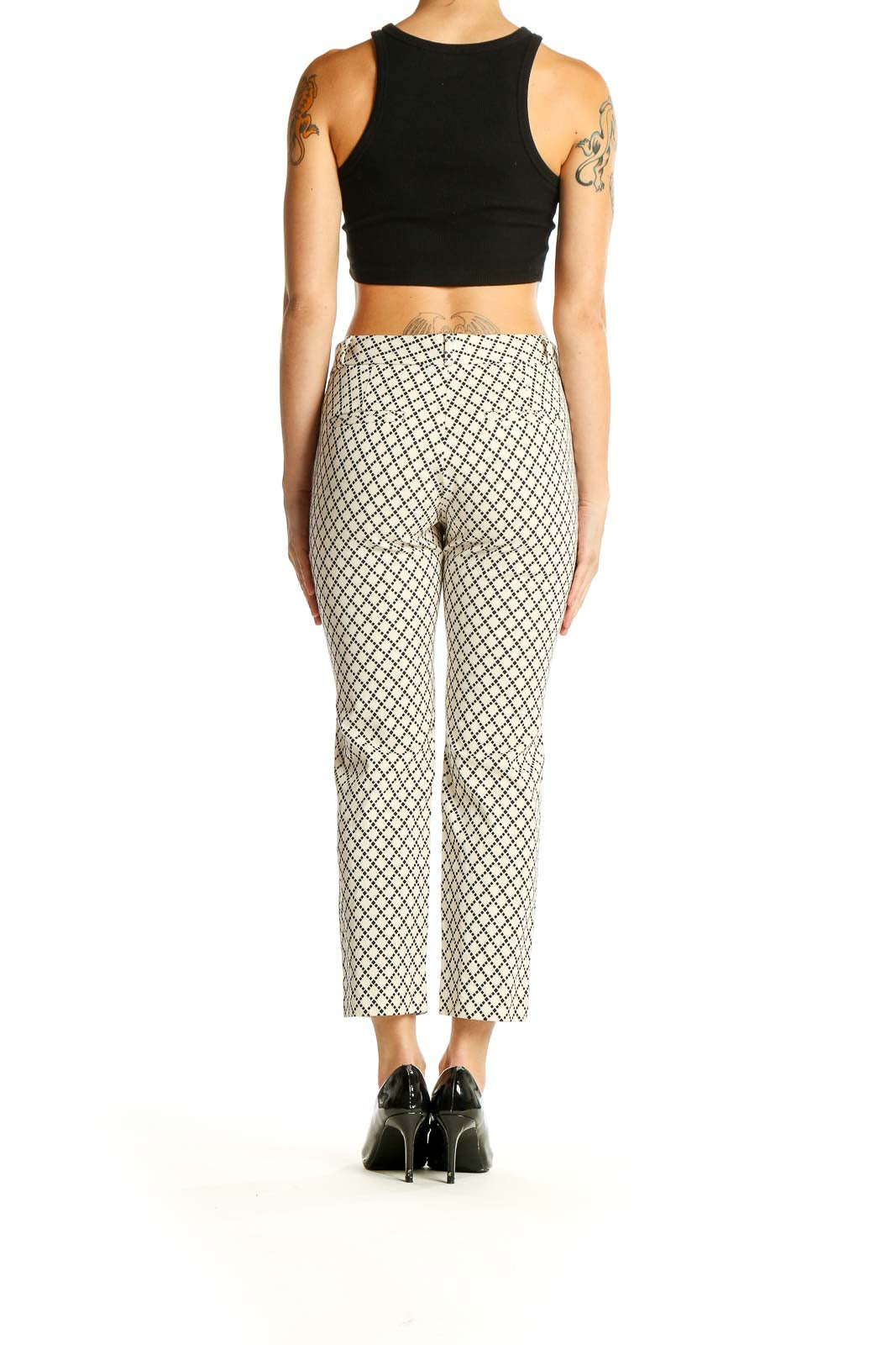 Side view of Banana Republic cream geometric print cropped pants on model with black top