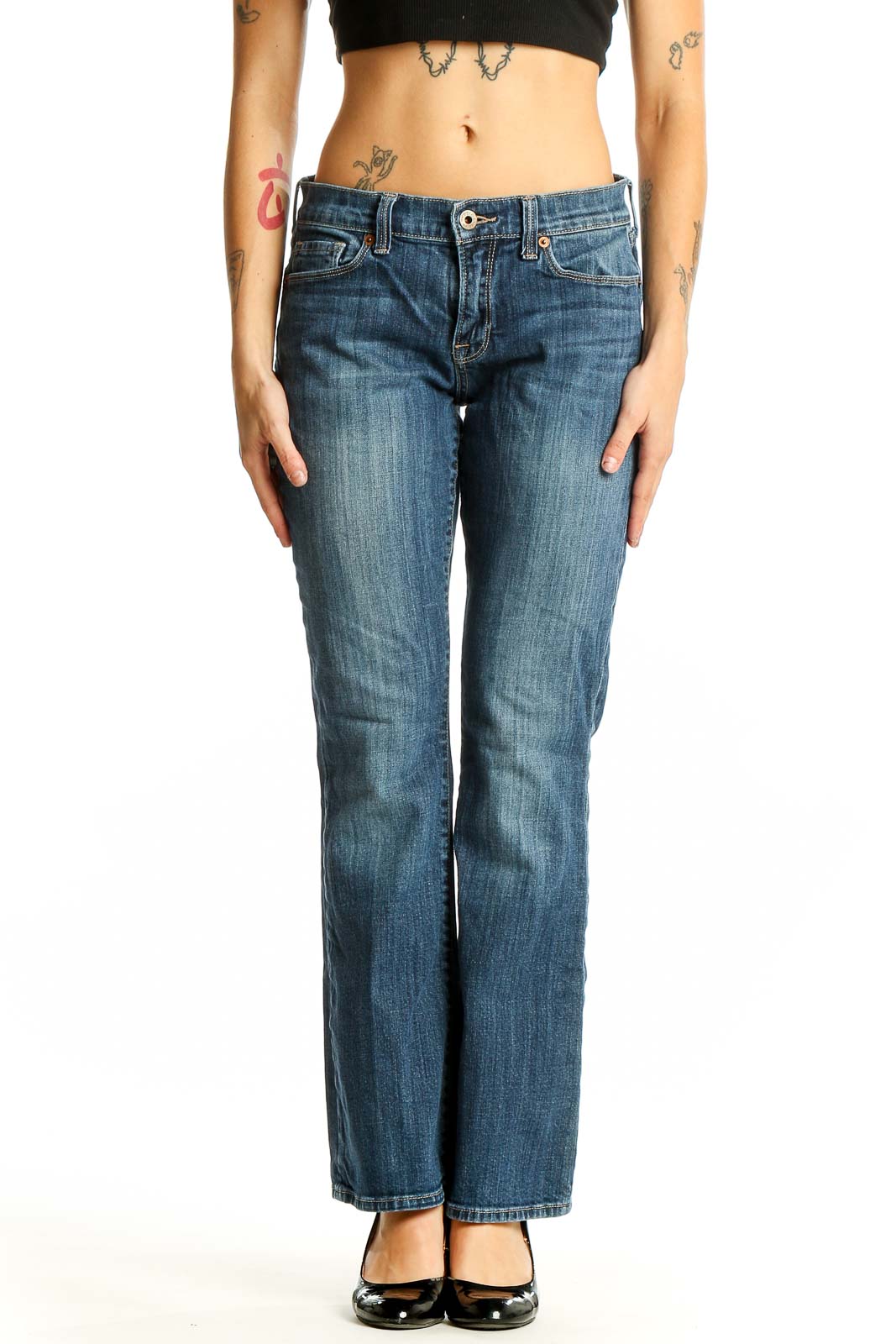 Front view of Lucky Brand blue bootcut jeans on woman