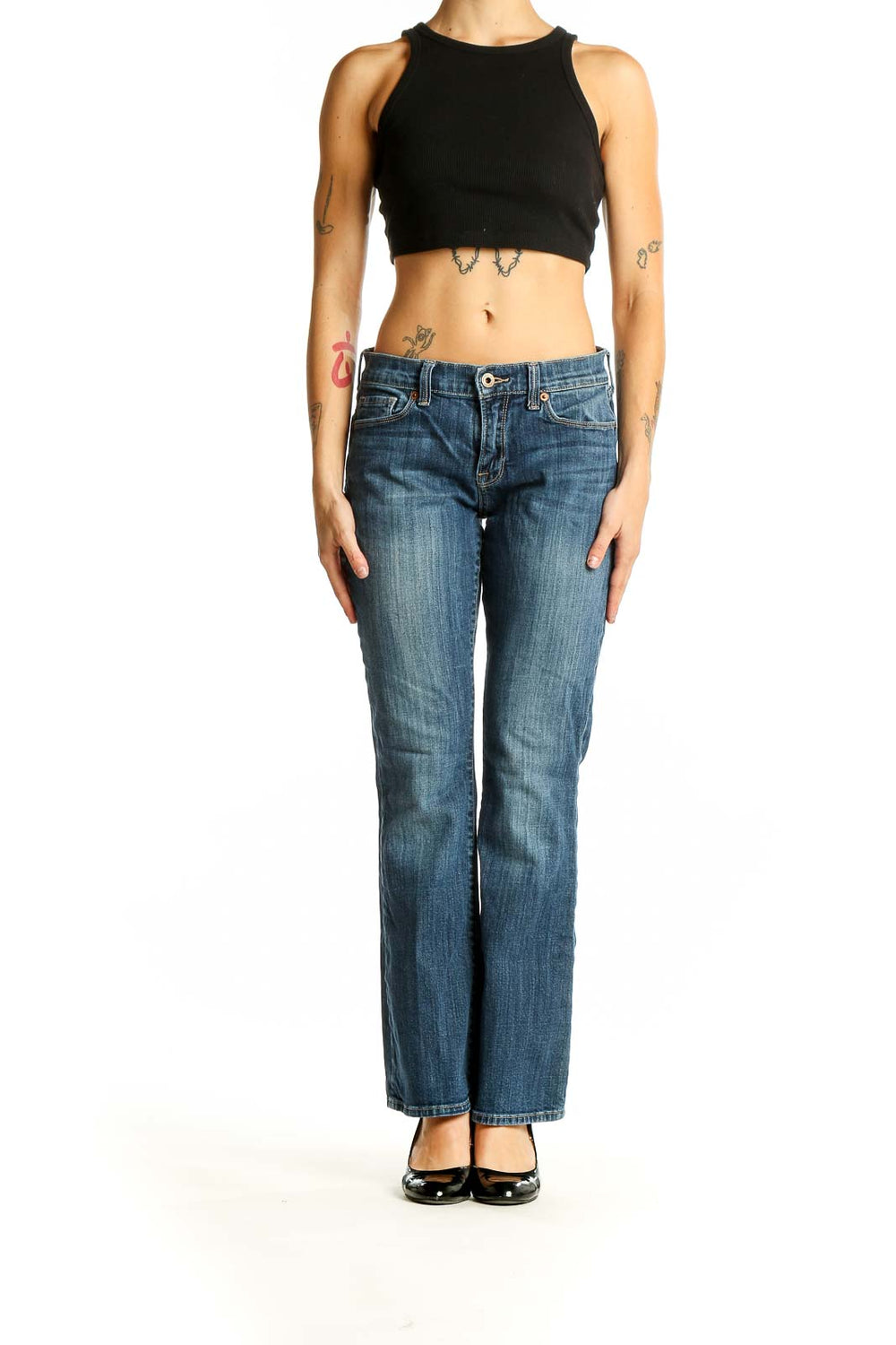 Front view of Lucky Brand blue bootcut jeans on woman