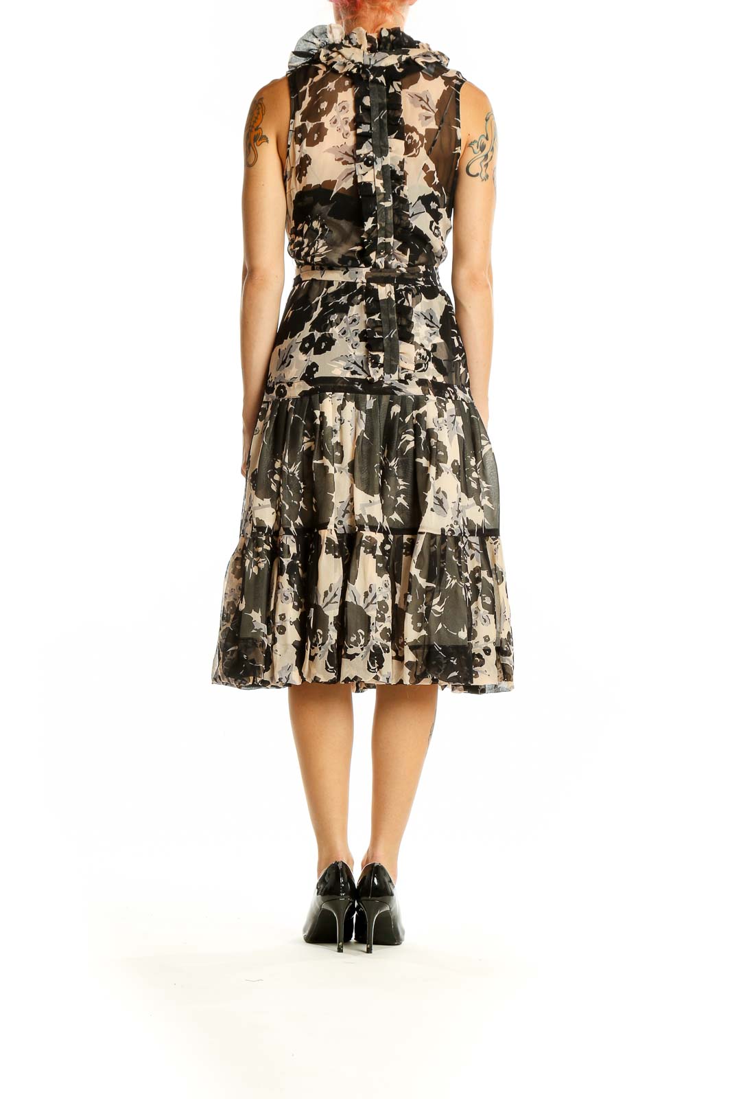 Side view of Tracy Reese black and beige floral silk midi dress showing tiered skirt and waist tie