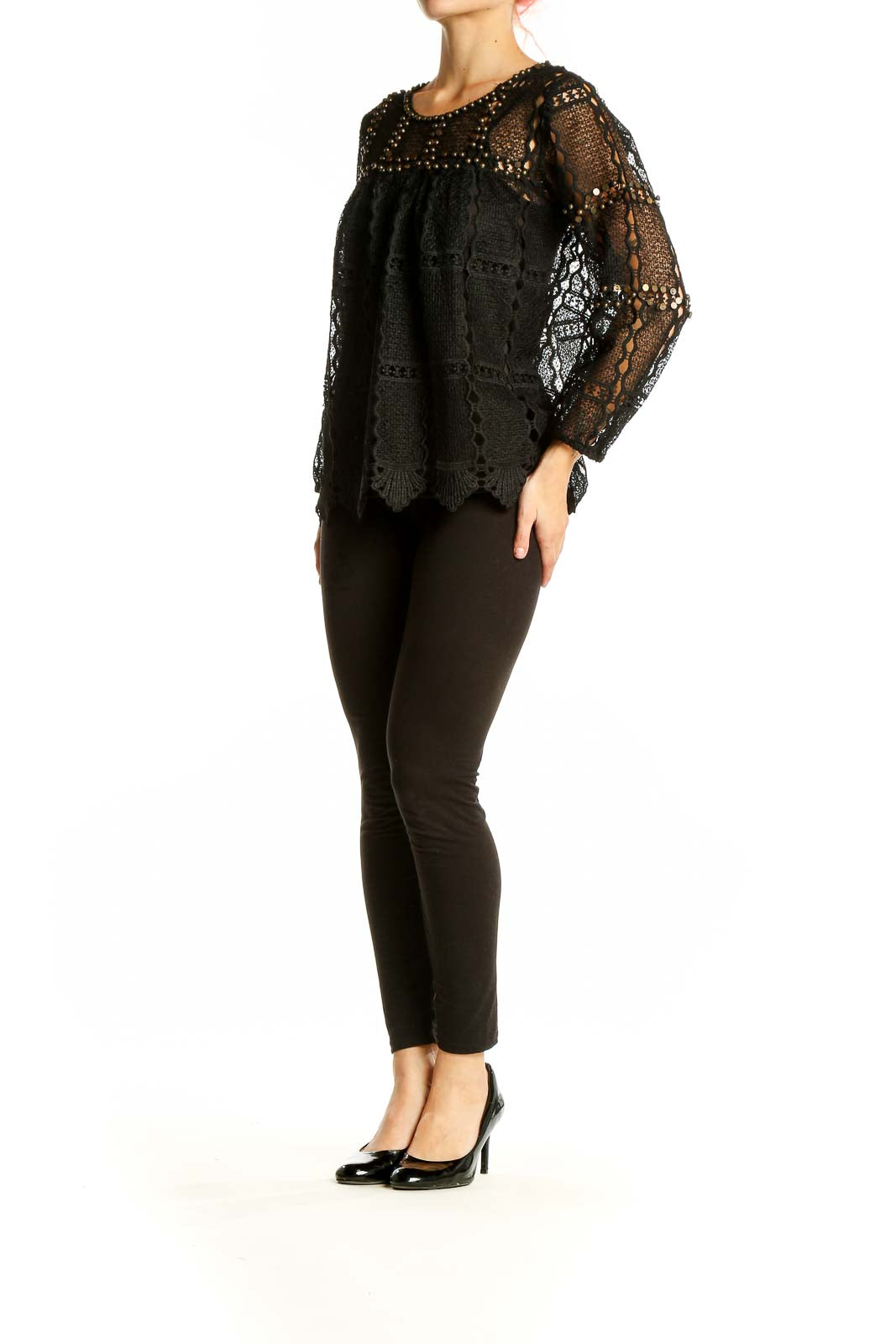 Front view of Maeve black lace crochet overlay blouse with gold studs