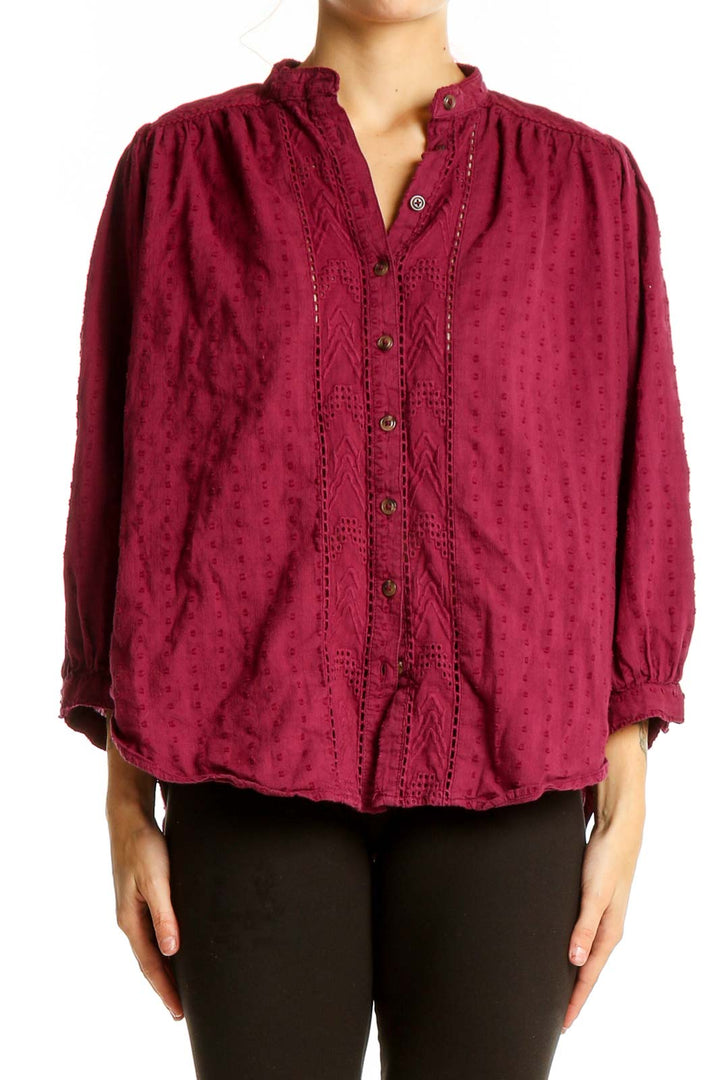 Front view of burgundy textured cotton blouse with button-up front and lace detailing