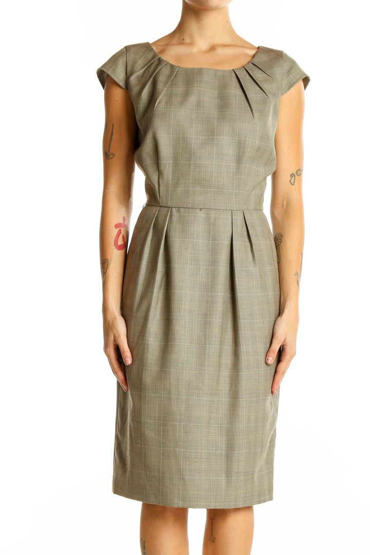 Front view of Calvin Klein taupe sheath dress with pleated neckline and cap sleeves