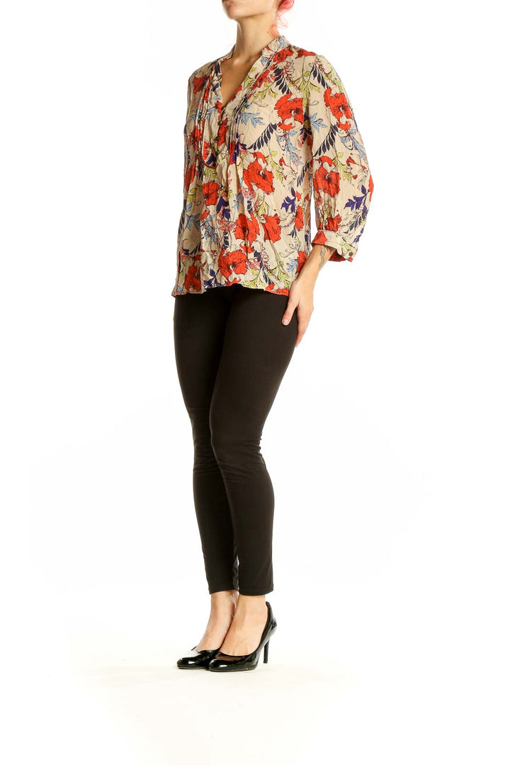 Front view of Banana Republic beige silk blouse with red floral print