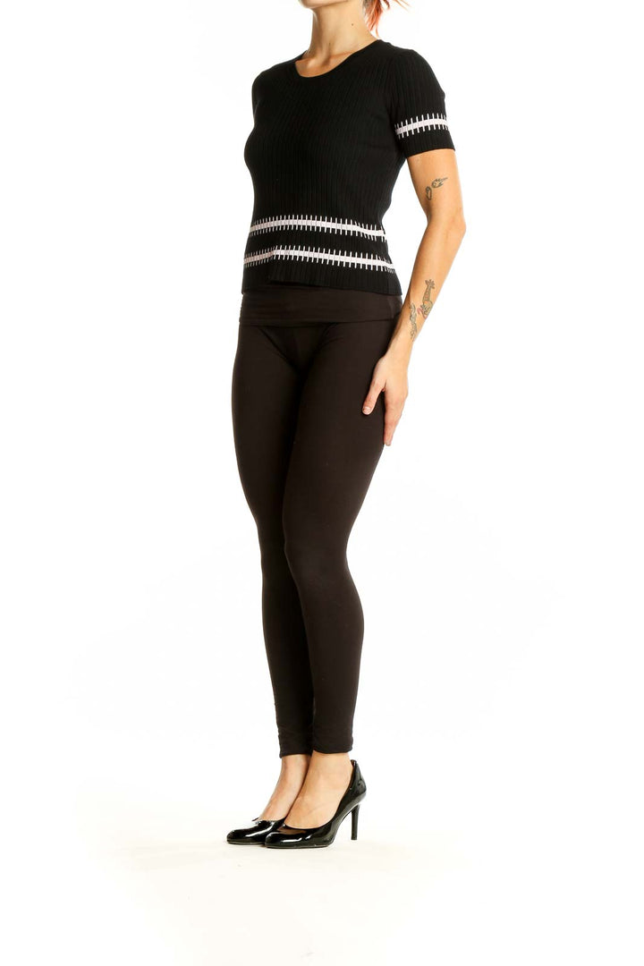 Front view of Armani Exchange black ribbed knit top with white stripes