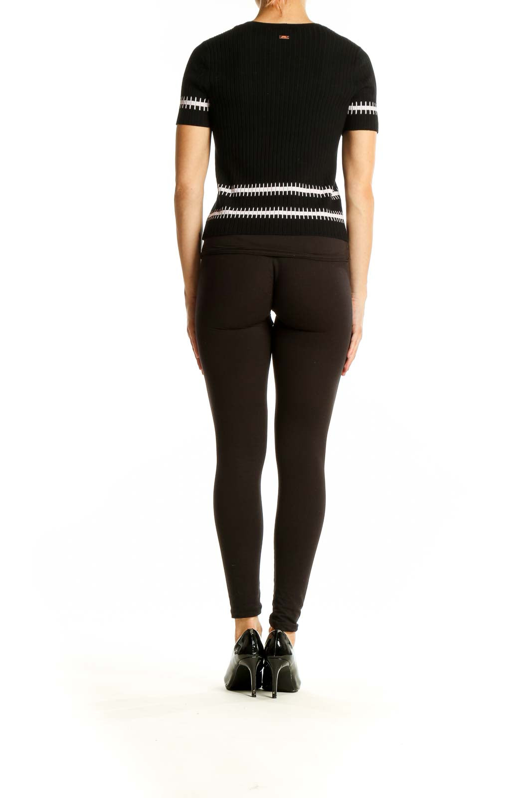 Side view of Armani Exchange black ribbed knit top with white stripes