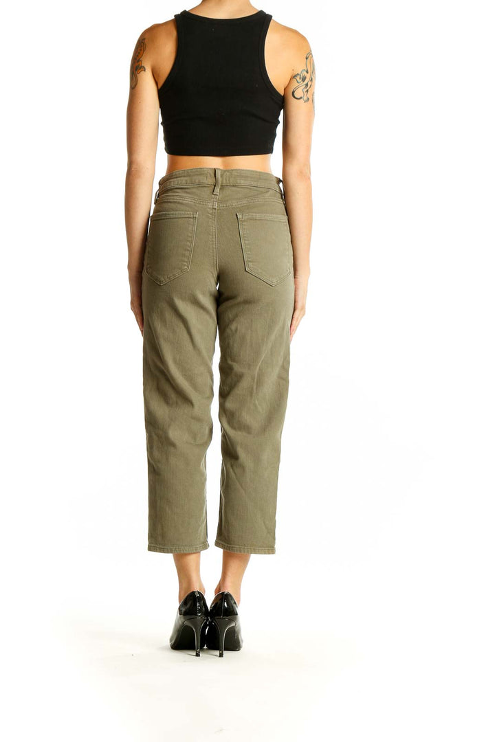 Side view of model wearing Athleta olive wide-leg cropped denim pants