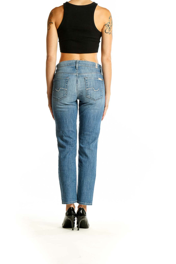 Back view of 7 For All Mankind light blue straight leg jeans on model