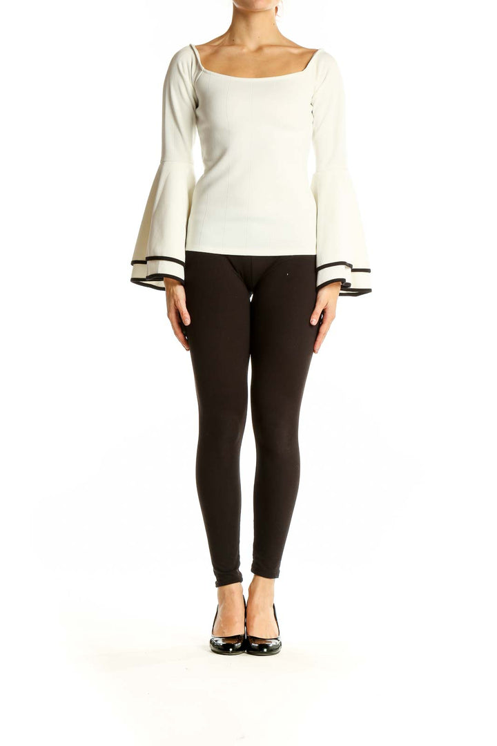 Front view of white bar III top with square neckline and bell sleeves