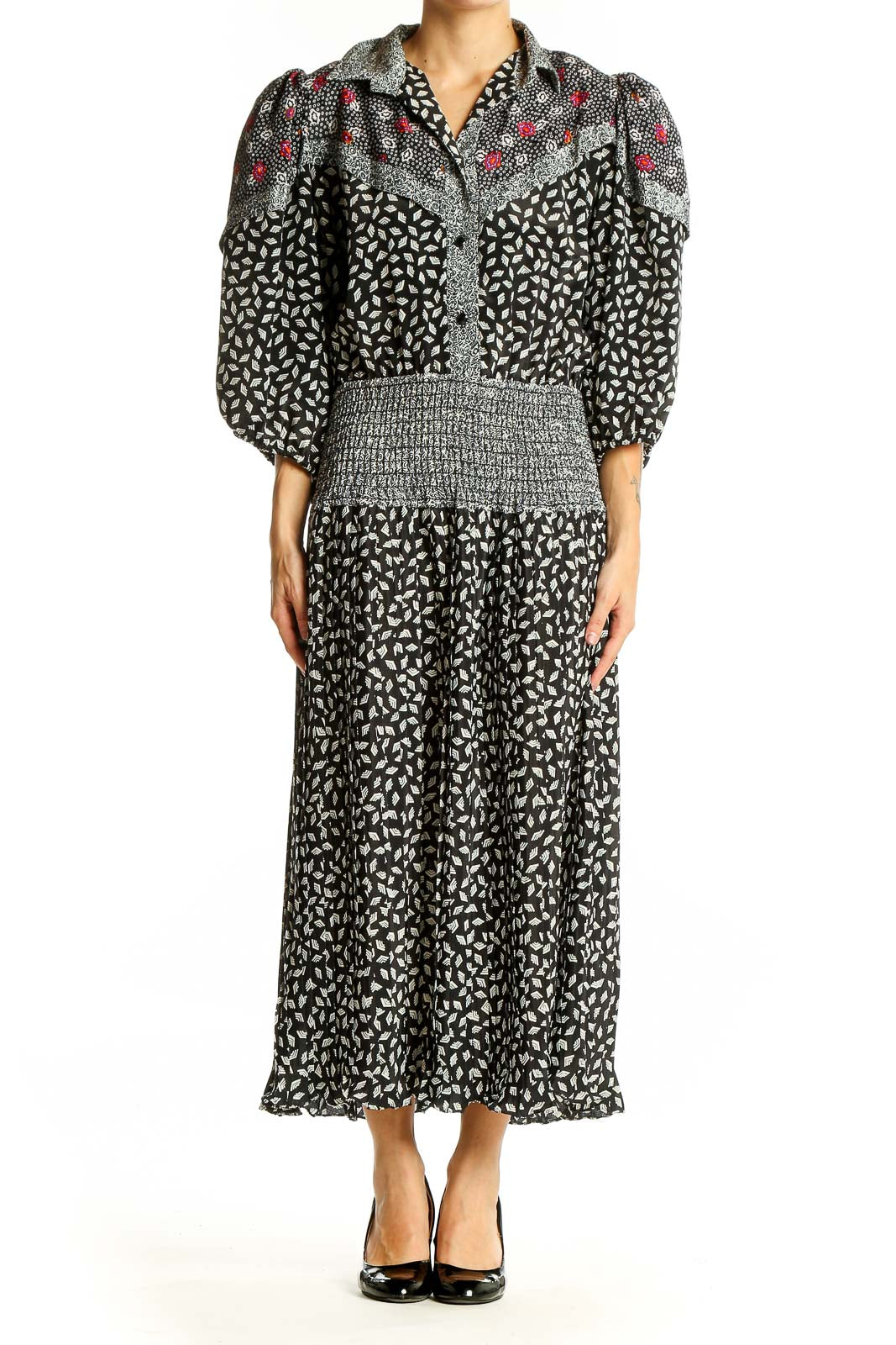 Front view of Susan Freis black floral print maxi dress with puff sleeves