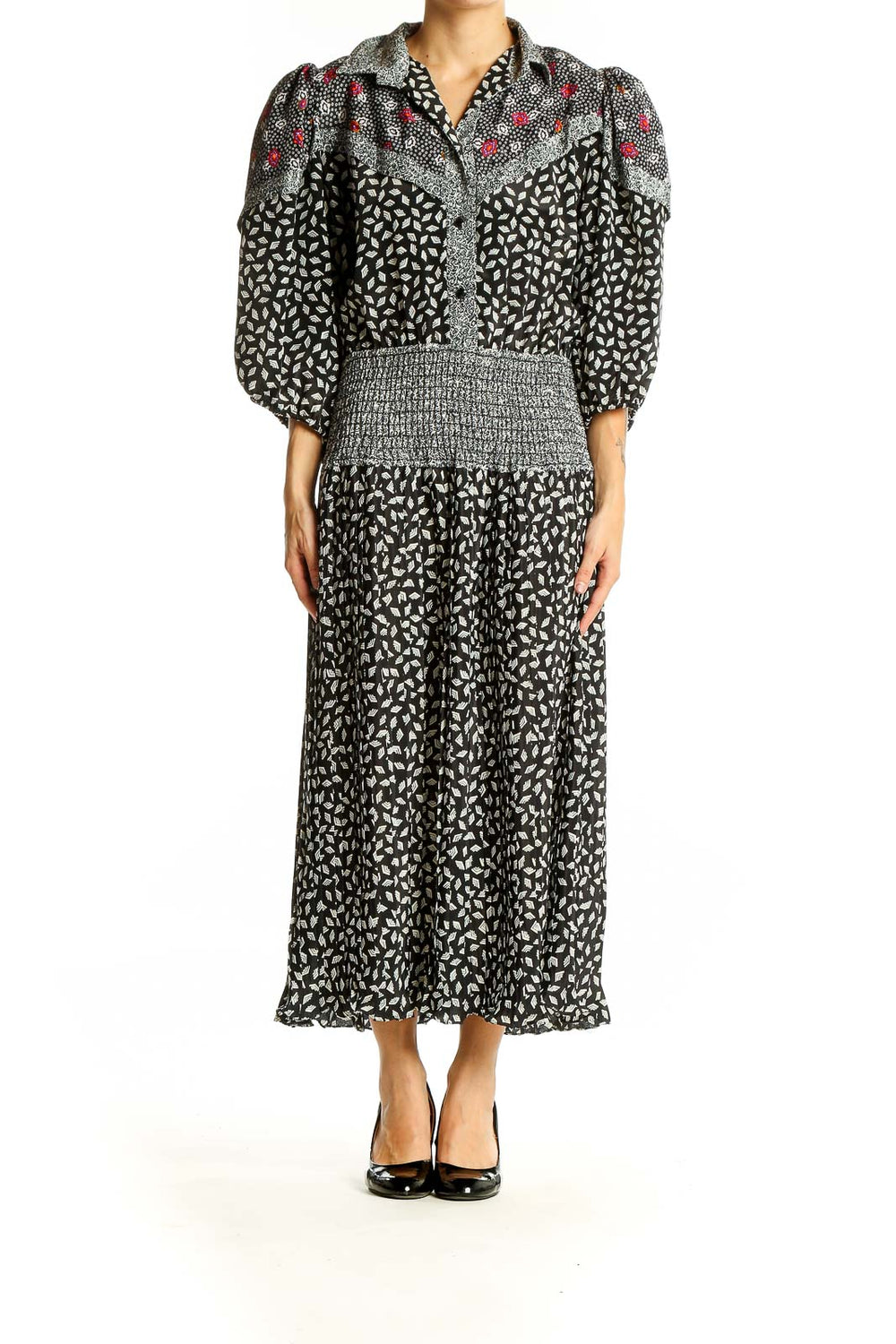 Front view of Susan Freis black floral print maxi dress with puff sleeves