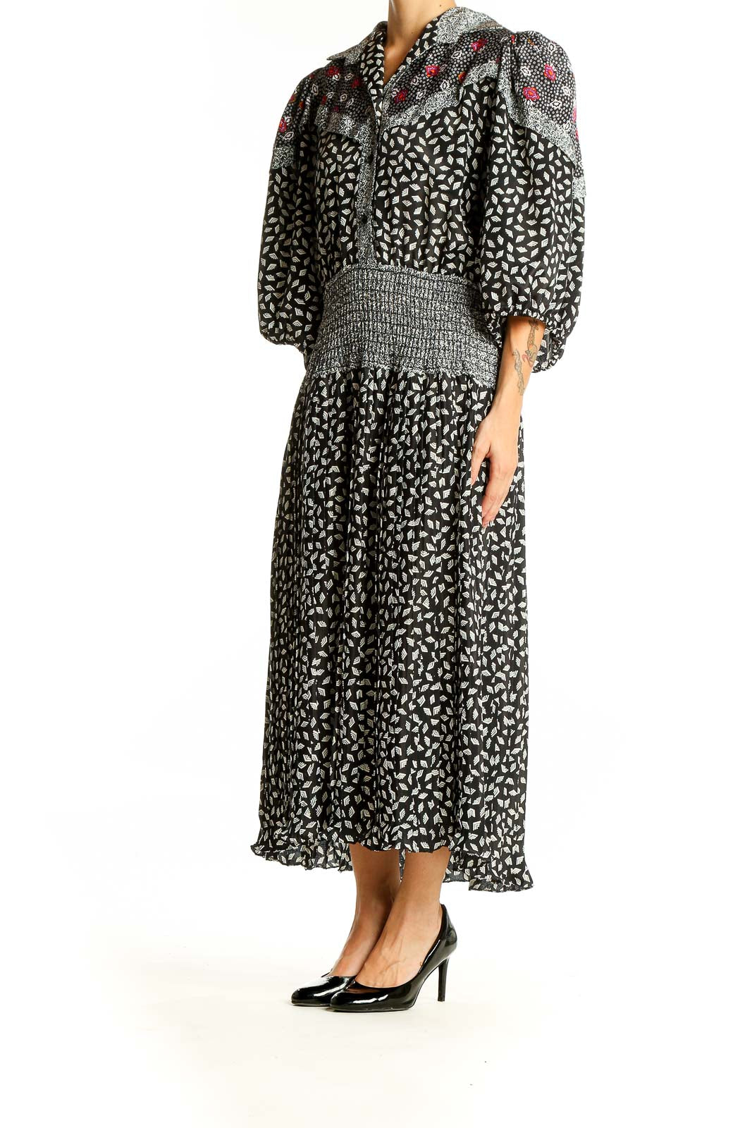 Front view of Susan Freis black floral print maxi dress with puff sleeves