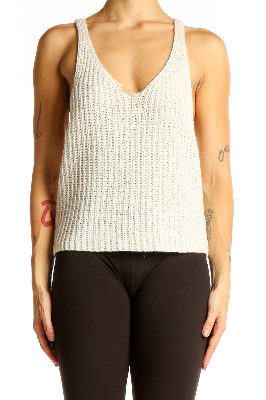 Front view of Moon+Madison white knitted V-neck sleeveless top on model