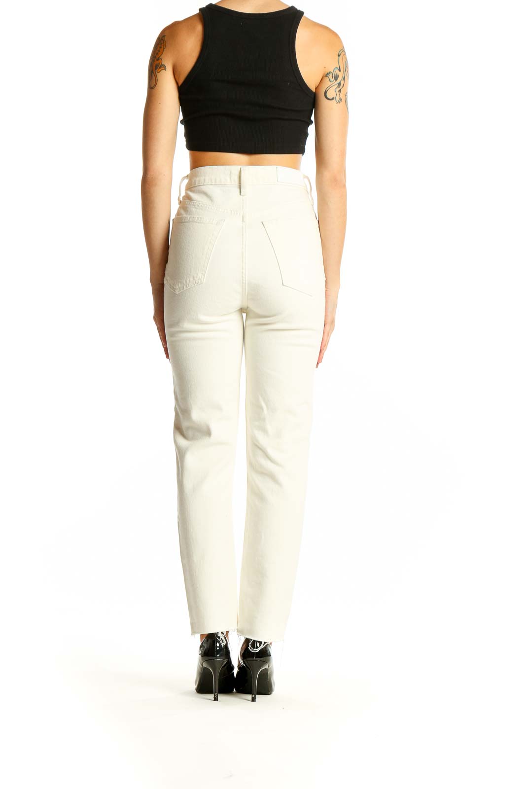 Side view of RE/DONE white high-waisted straight-leg jeans on model