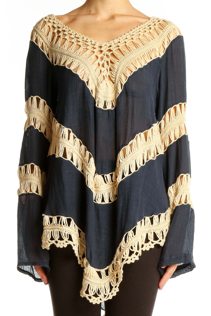 Front view of Umgee navy tunic top with beige crochet trim in chevron pattern